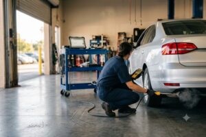 Auto Mechanic checking a car's auto emissions.
